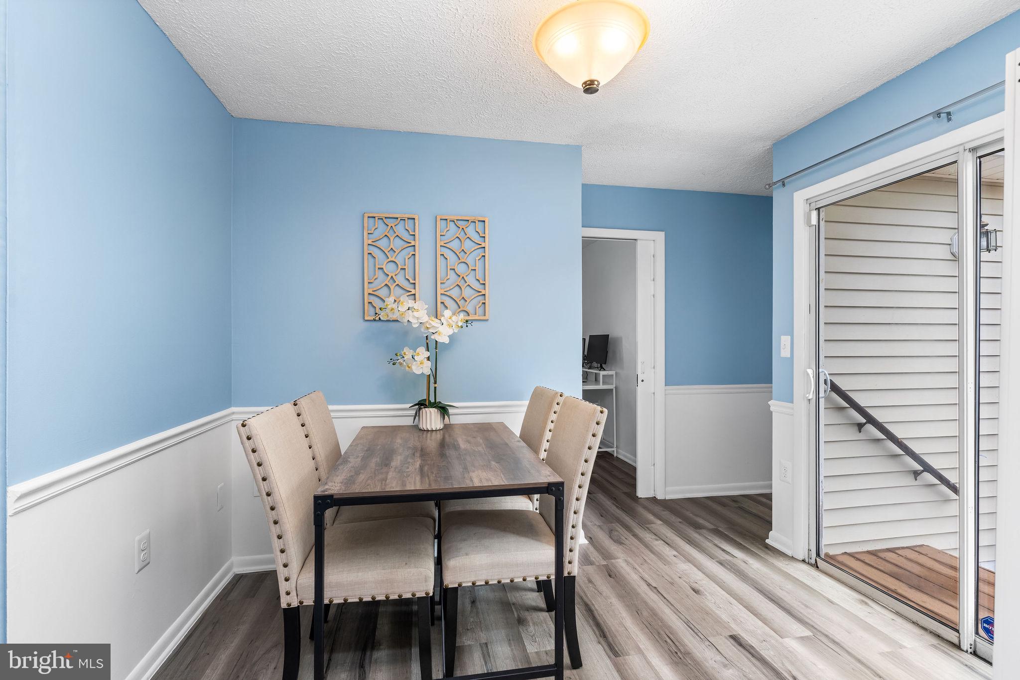 313 Park Hall South Laurel, MD 20724 - Photo 9 of 30 a view of a dining room with furniture and wooden floor