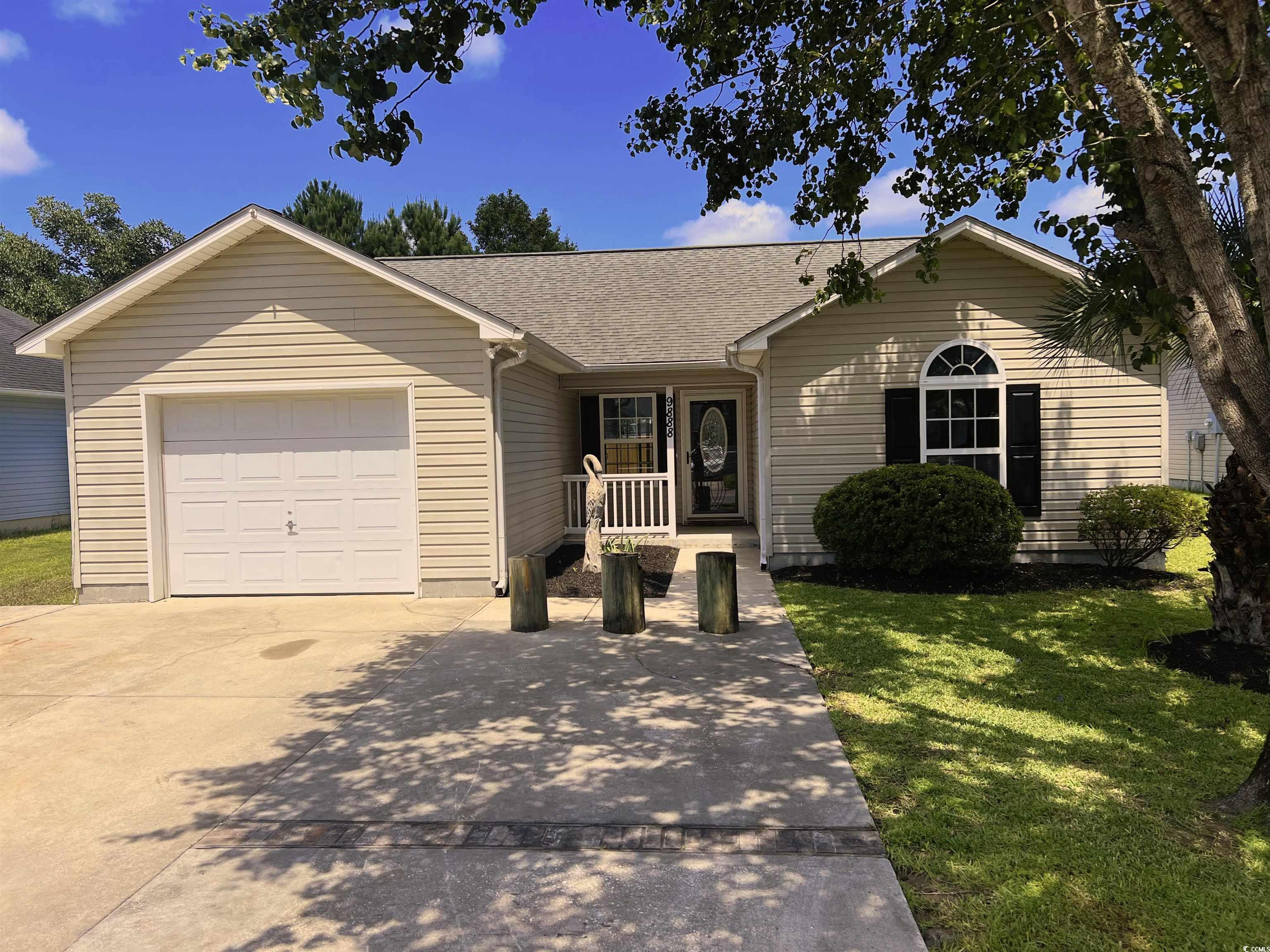 9888 Conifer Lane Murrells Inlet, SC 29576 - Photo 1 of 11 Ranch-style house with an attached garage, a front