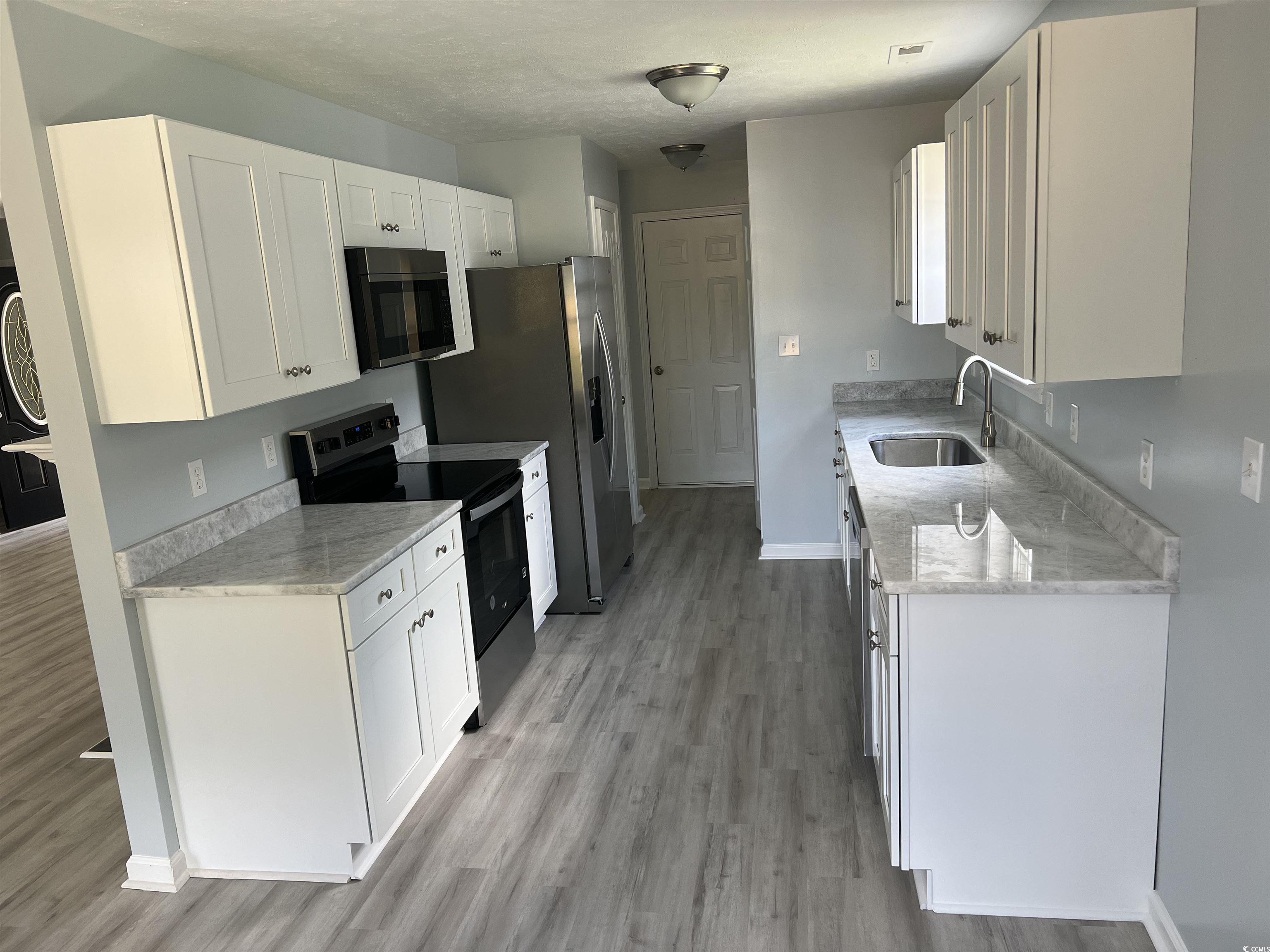 9888 Conifer Lane Murrells Inlet, SC 29576 - Photo 6 of 11 Kitchen featuring appliances with stainless steel