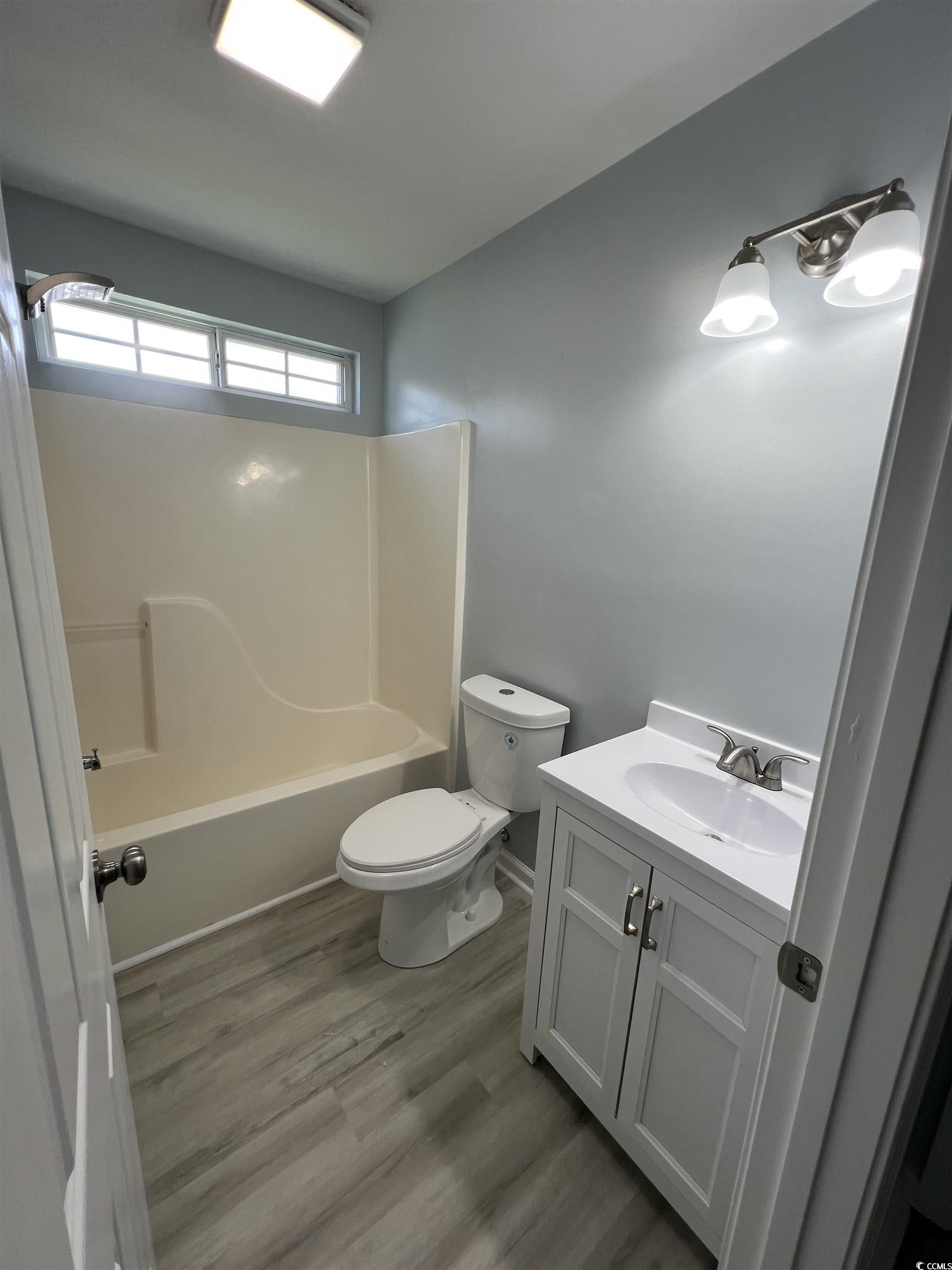 9888 Conifer Lane Murrells Inlet, SC 29576 - Photo 9 of 11 Bathroom featuring vanity, tub / shower combinatio