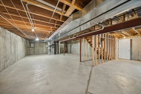 a view of an empty room with wooden walls