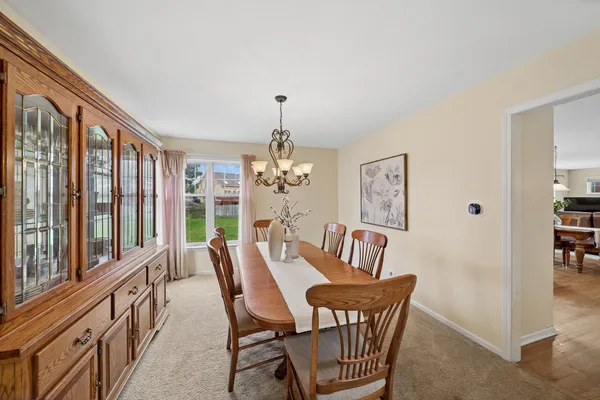 a view of a dining room with furniture window and outside view