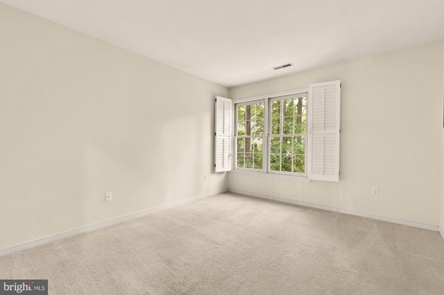 a bed room with a bed and a chandelier