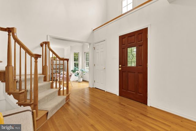 a view of a livingroom with furniture and hardwood floor