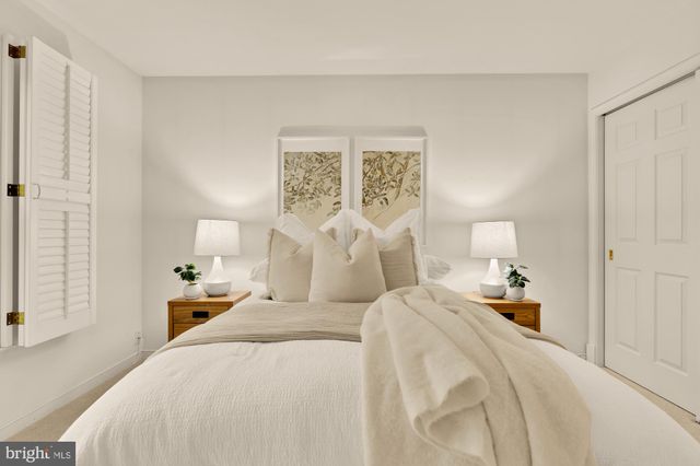 a living room with furniture and a lamp