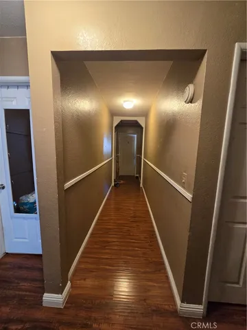 a bedroom with furniture and a flat screen tv
