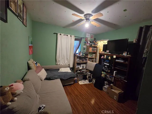 a bedroom with bed and a chandelier