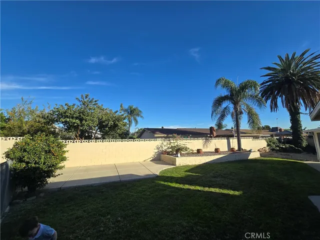 a view of a swimming pool and lounge chair