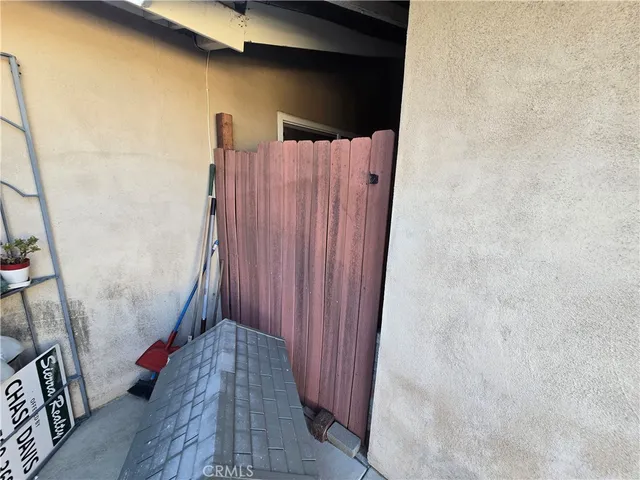 a room with a washing machine and a fireplace