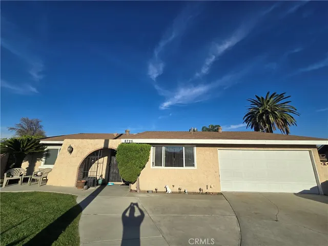 a view of a livingroom with furniture wooden floor and window