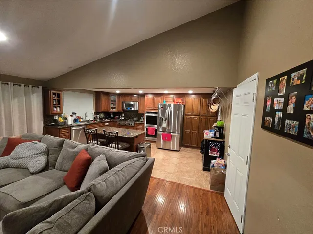 a living room with furniture a air conditioner vent and a window