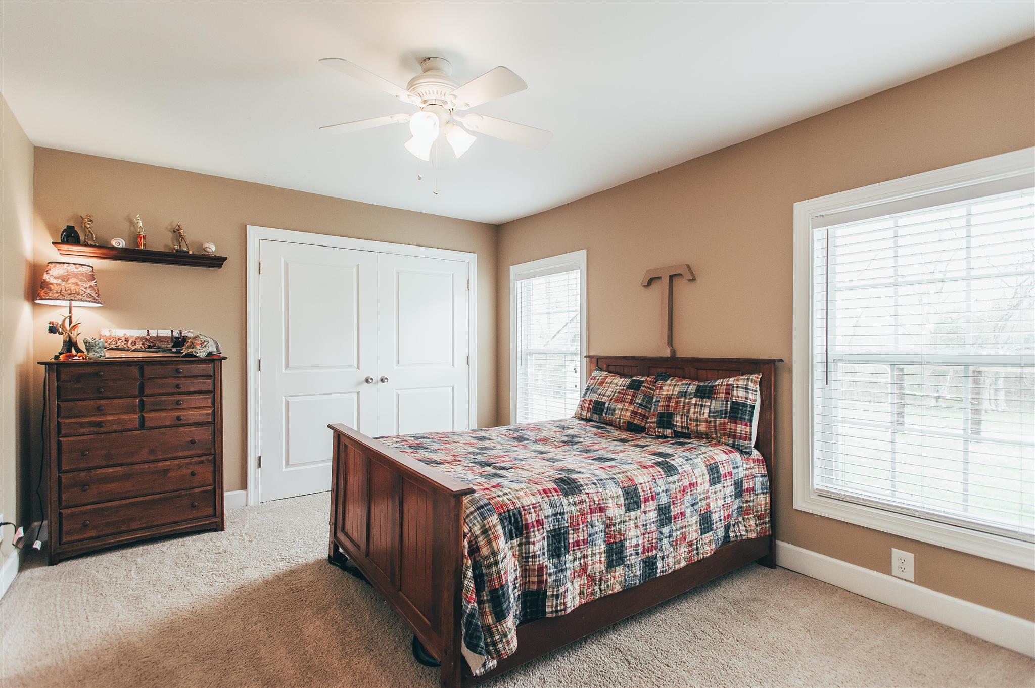 498 Canoe Branch Road Castalian Springs, TN 37031 - Photo 16 of 30 a bedroom with a bed and a dresser