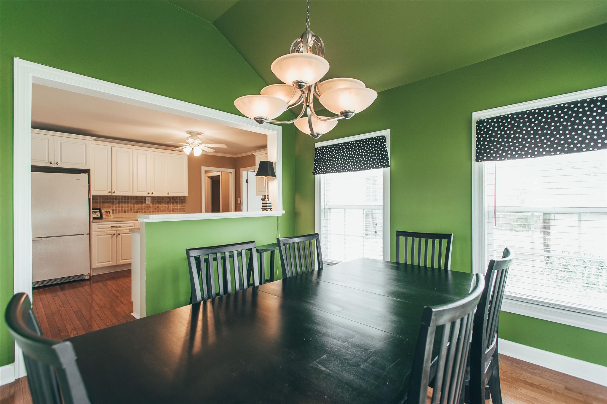 498 Canoe Branch Road Castalian Springs, TN 37031 - Photo 10 of 30 a view of a dining room with furniture window and wooden floor