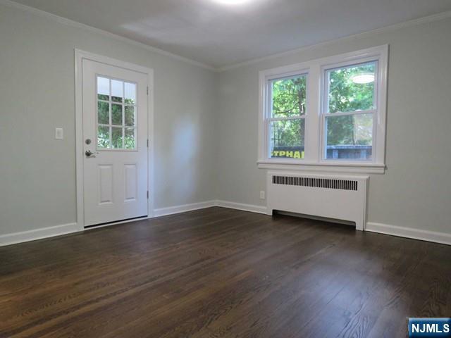 289 Hardenburgh Avenue Demarest, NJ 07627 - Photo 11 of 43 a view of an empty room with wooden floor and a window