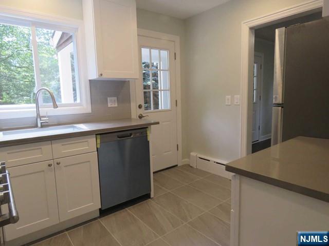 289 Hardenburgh Avenue Demarest, NJ 07627 - Photo 16 of 43 a kitchen with a sink and large window