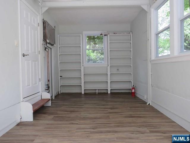 289 Hardenburgh Avenue Demarest, NJ 07627 - Photo 19 of 43 a view of an empty room with a window and wooden floor