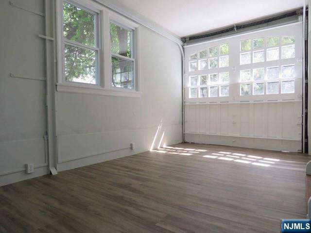 289 Hardenburgh Avenue Demarest, NJ 07627 - Photo 20 of 43 a view of an empty room with wooden floor and a window