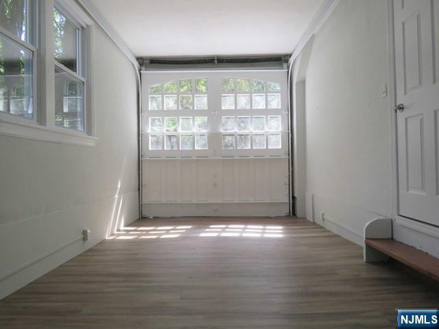 289 Hardenburgh Avenue Demarest, NJ 07627 - Photo 21 of 43 a view of an empty room with wooden floor and a window