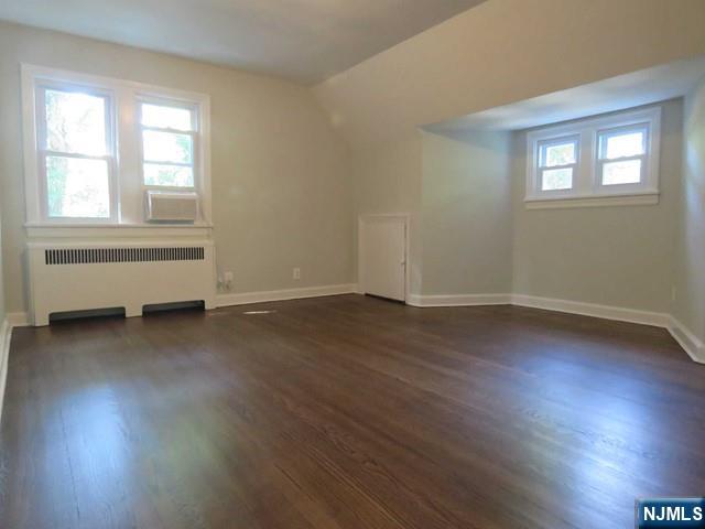 289 Hardenburgh Avenue Demarest, NJ 07627 - Photo 24 of 43 an empty room with wooden floor and windows