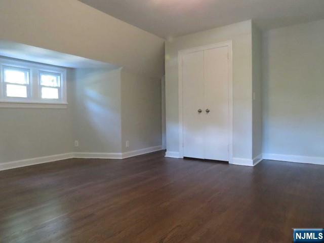 289 Hardenburgh Avenue Demarest, NJ 07627 - Photo 25 of 43 a view of an empty room with wooden floor and a window