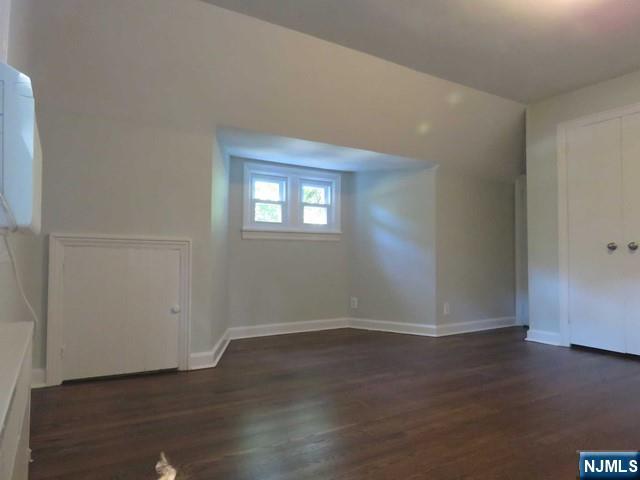289 Hardenburgh Avenue Demarest, NJ 07627 - Photo 26 of 43 an empty room with wooden floor and windows