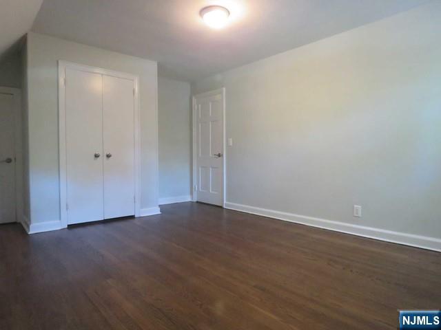 289 Hardenburgh Avenue Demarest, NJ 07627 - Photo 27 of 43 a view of an empty room with wooden floor