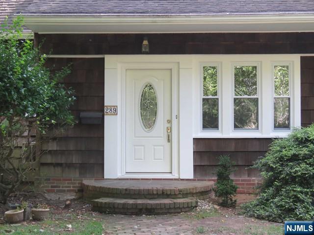 289 Hardenburgh Avenue Demarest, NJ 07627 - Photo 3 of 43 a front view of a house with a yard