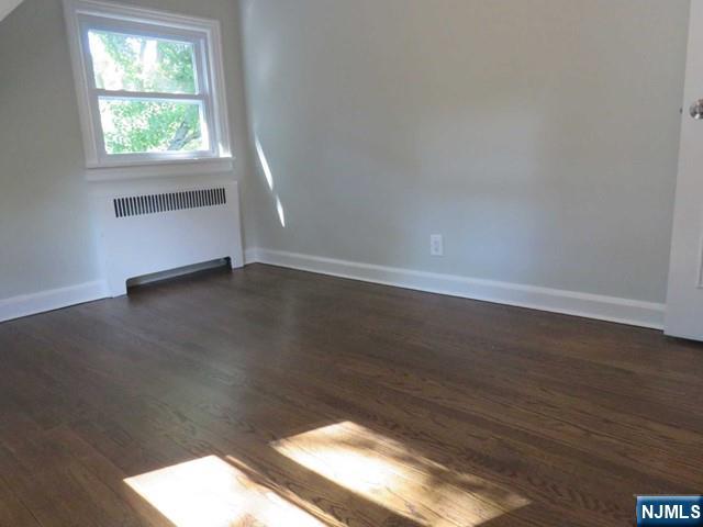 289 Hardenburgh Avenue Demarest, NJ 07627 - Photo 31 of 43 an empty room with wooden floor and windows