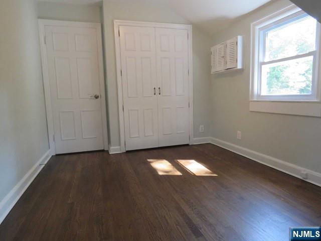 289 Hardenburgh Avenue Demarest, NJ 07627 - Photo 32 of 43 an empty room with wooden floor and windows