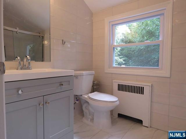 289 Hardenburgh Avenue Demarest, NJ 07627 - Photo 33 of 43 a bathroom with a sink toilet and a mirror