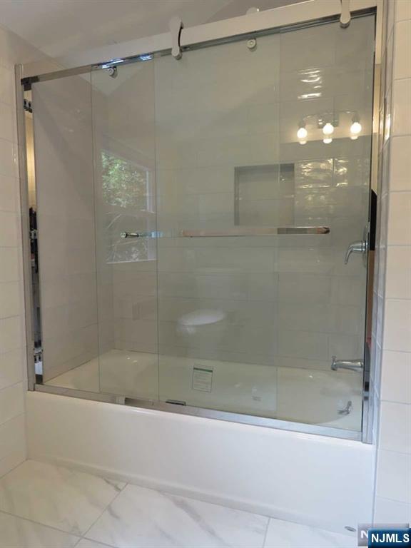 289 Hardenburgh Avenue Demarest, NJ 07627 - Photo 37 of 43 a bathroom with a shower and a bath tub