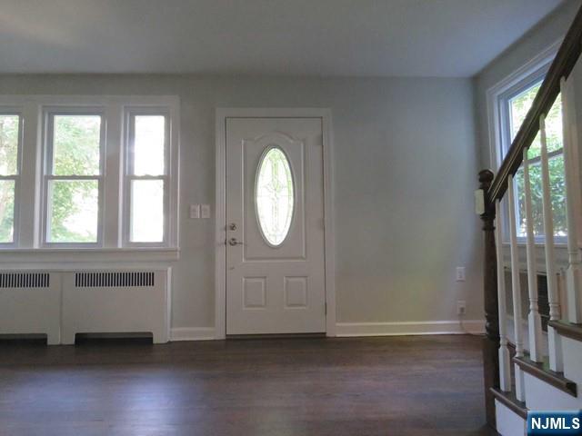 289 Hardenburgh Avenue Demarest, NJ 07627 - Photo 4 of 43 an empty room with wooden floor and windows