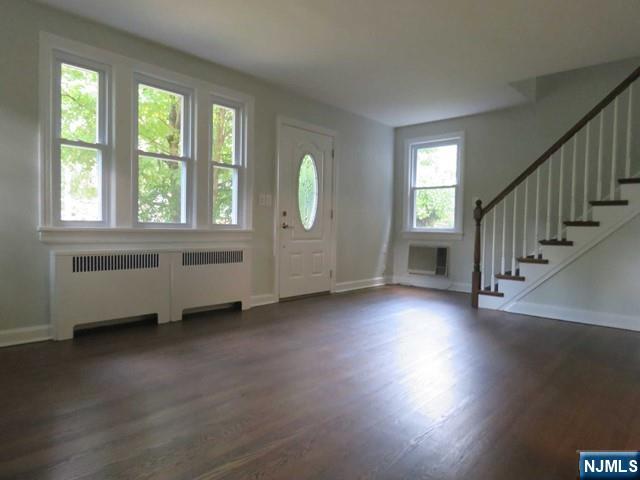 289 Hardenburgh Avenue Demarest, NJ 07627 - Photo 7 of 43 an empty room with wooden floor and windows