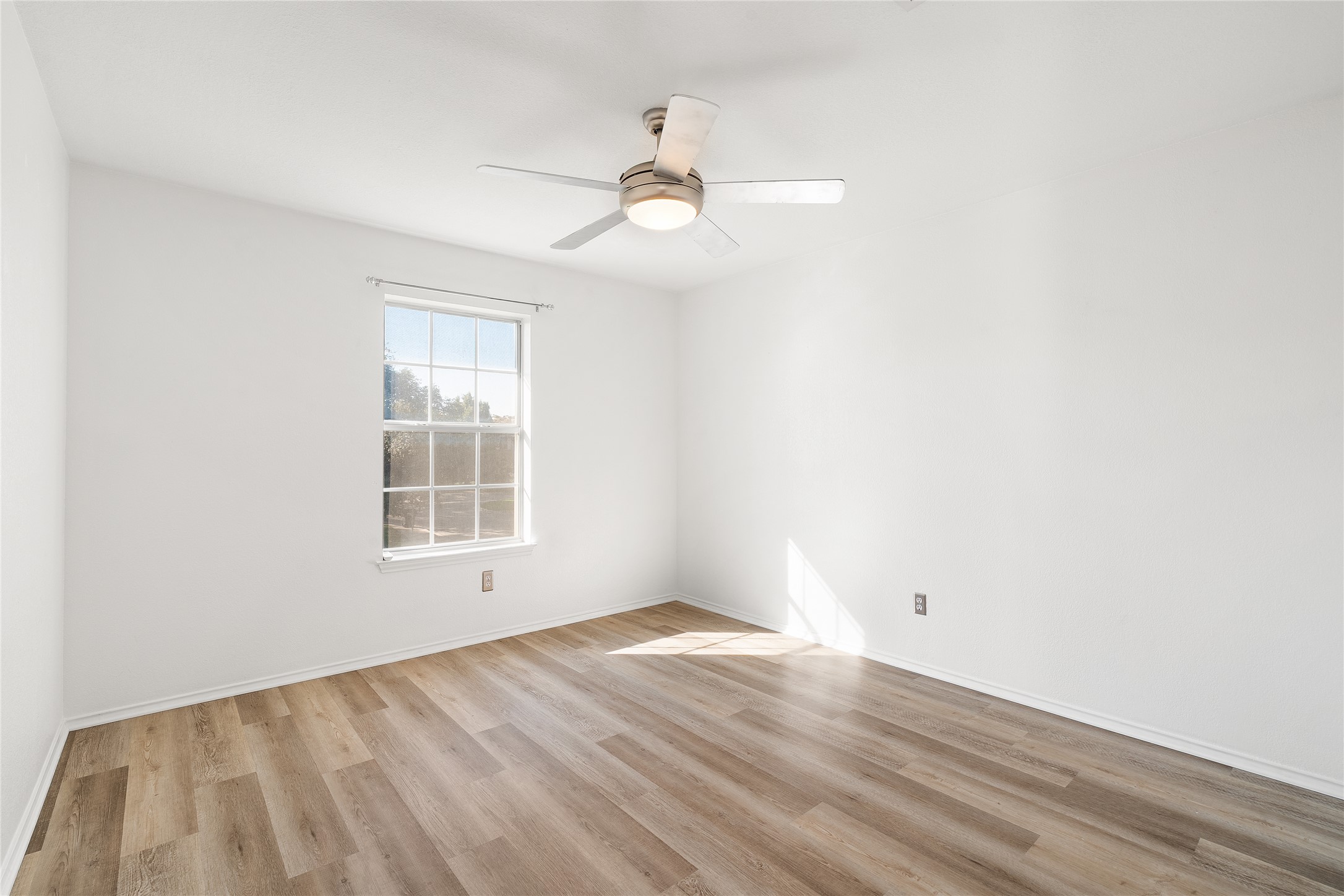 206 River Down Road Georgetown, TX 78628 - Photo 25 of 39 Neutral white walls with wood-finish flooring