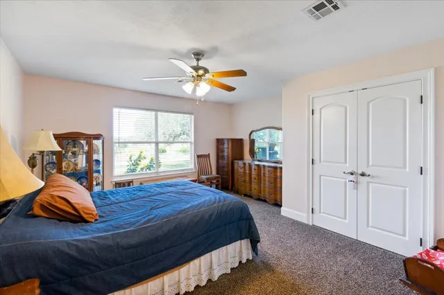 a bedroom with furniture and a window