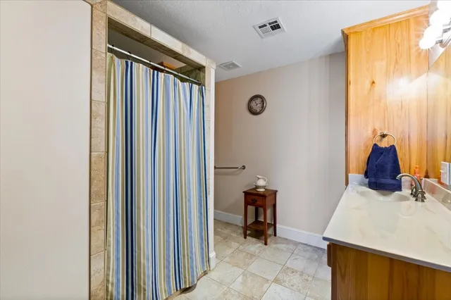 a view of a hallway with workspace and a window