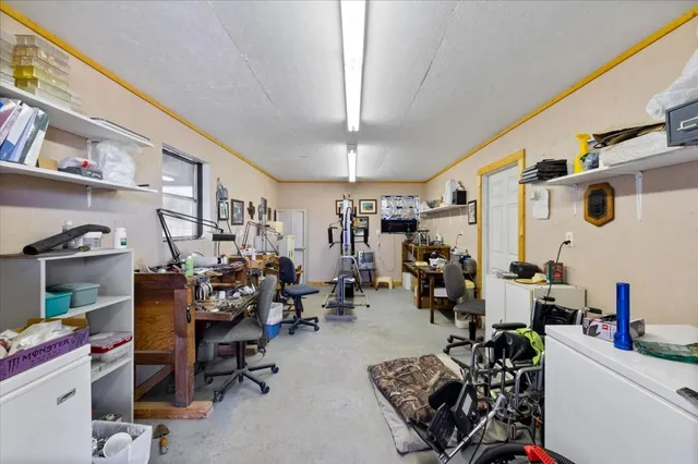 a room with gym equipment and a large window