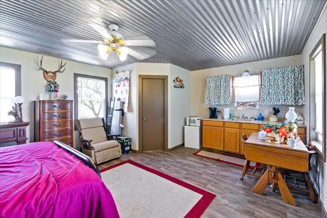 a bed room with a bed furniture and a chandelier