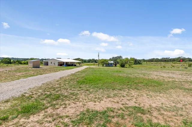 a view of a field with an ocean