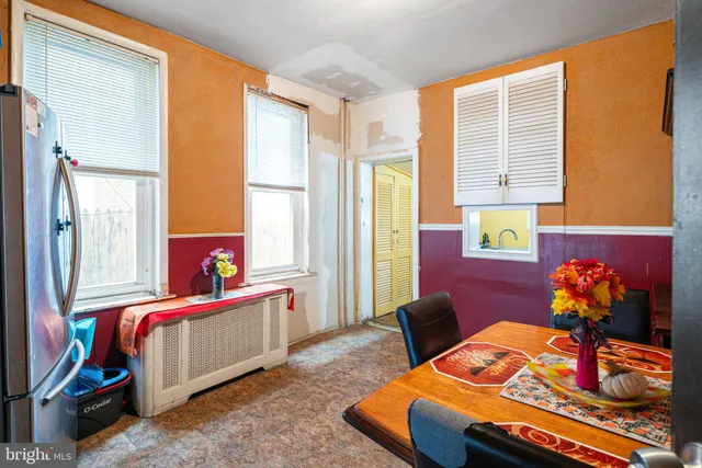 a bed room with a bed chair and a window