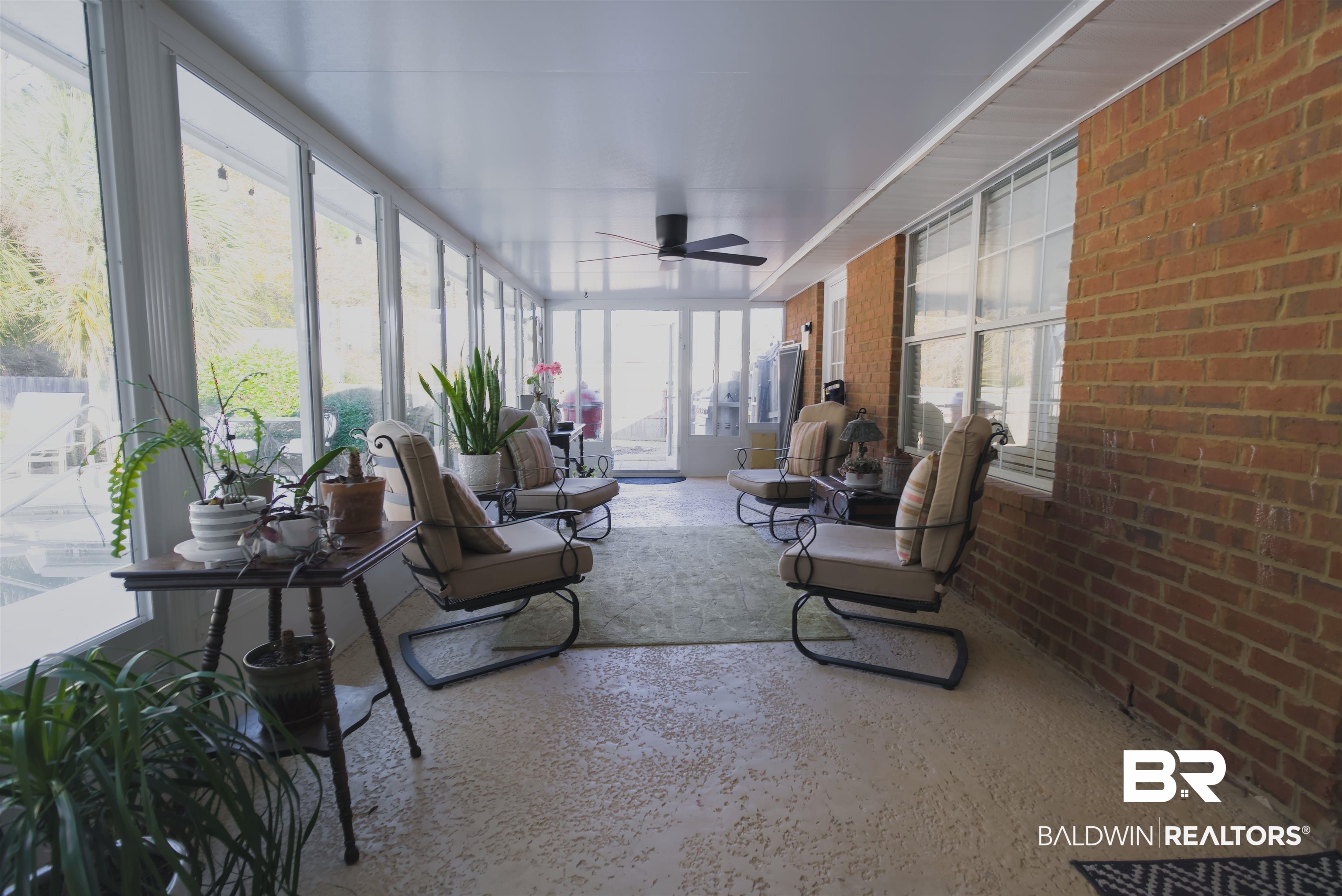 373 Collinwood Loop Foley, AL 36535 - Photo 49 of 49 Expansive sunroom featuring a brick exterior wall and a full wall of windows