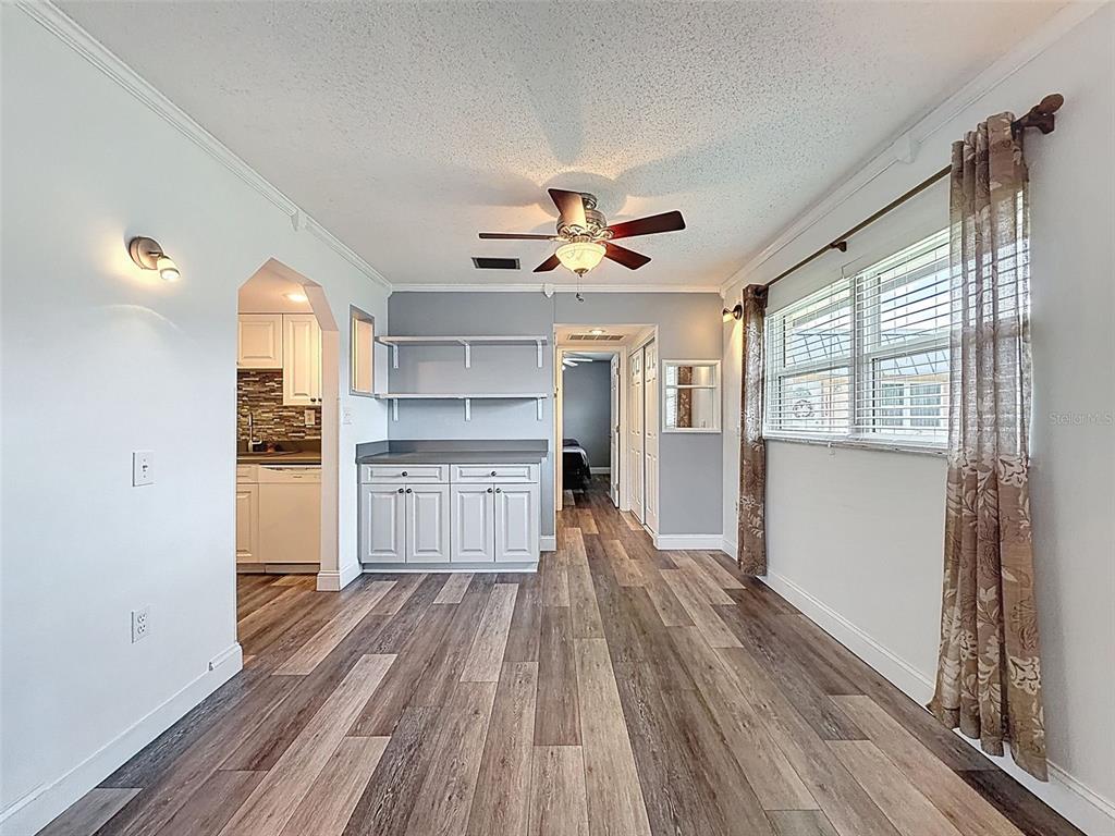 11832 Boynton Lane, Unit 24B New Port Richey, FL 34654 - Photo 16 of 42 a view of a kitchen with wooden floor and a kitchen
