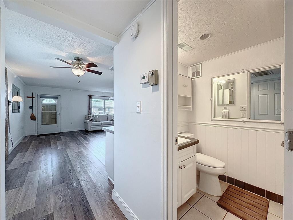11832 Boynton Lane, Unit 24B New Port Richey, FL 34654 - Photo 17 of 42 a view of a bathroom with a hardwood floor and a sink