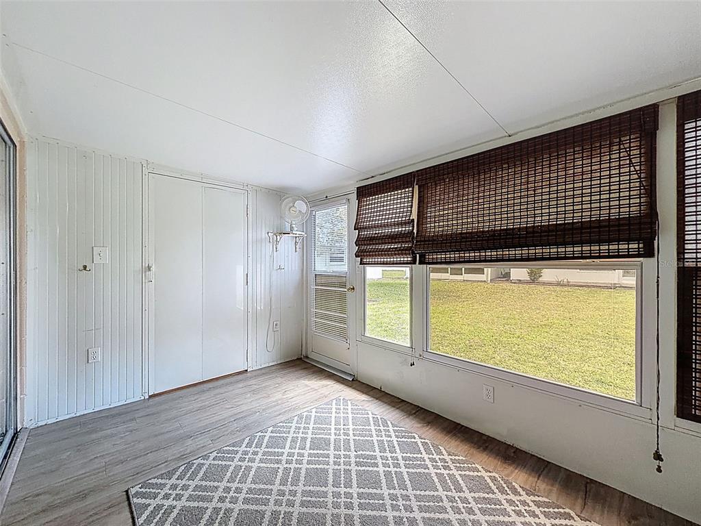 11832 Boynton Lane, Unit 24B New Port Richey, FL 34654 - Photo 26 of 42 a view of a livingroom with an empty space and window