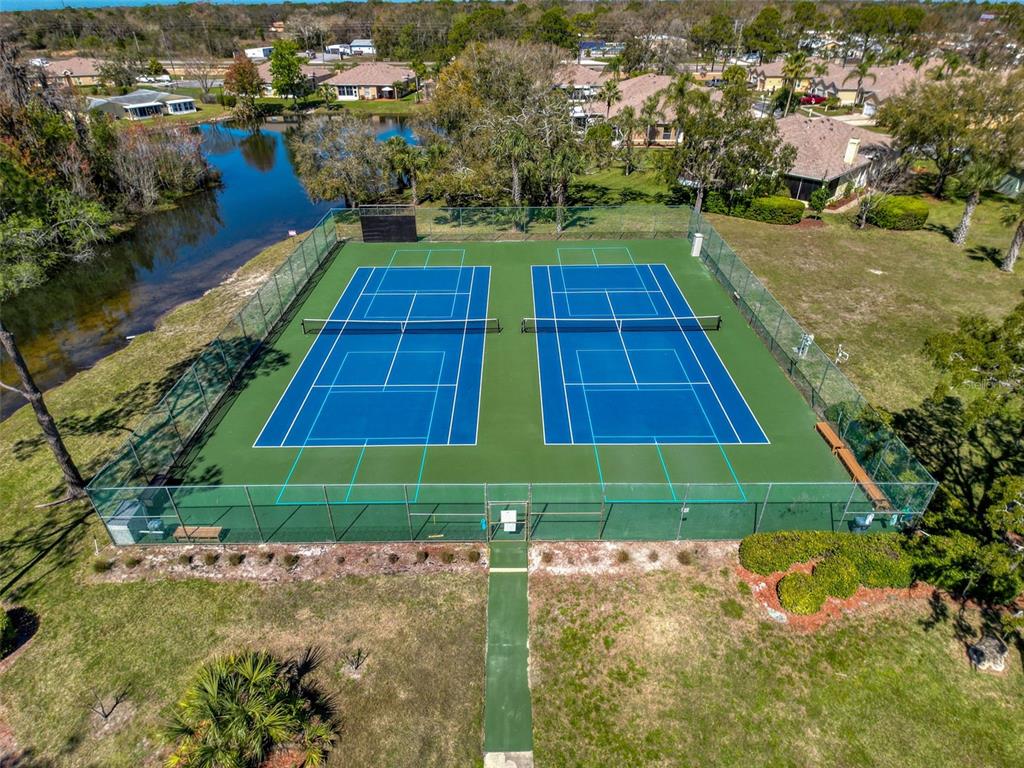 11832 Boynton Lane, Unit 24B New Port Richey, FL 34654 - Photo 41 of 42 a view of a yard