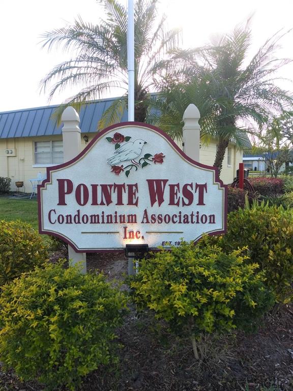 11832 Boynton Lane, Unit 24B New Port Richey, FL 34654 - Photo 42 of 42 a sign on the side of a building