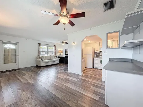 a view of a kitchen cabinets and wooden floor