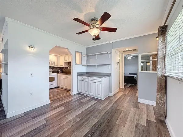a kitchen with stainless steel appliances a refrigerator and a stove top oven