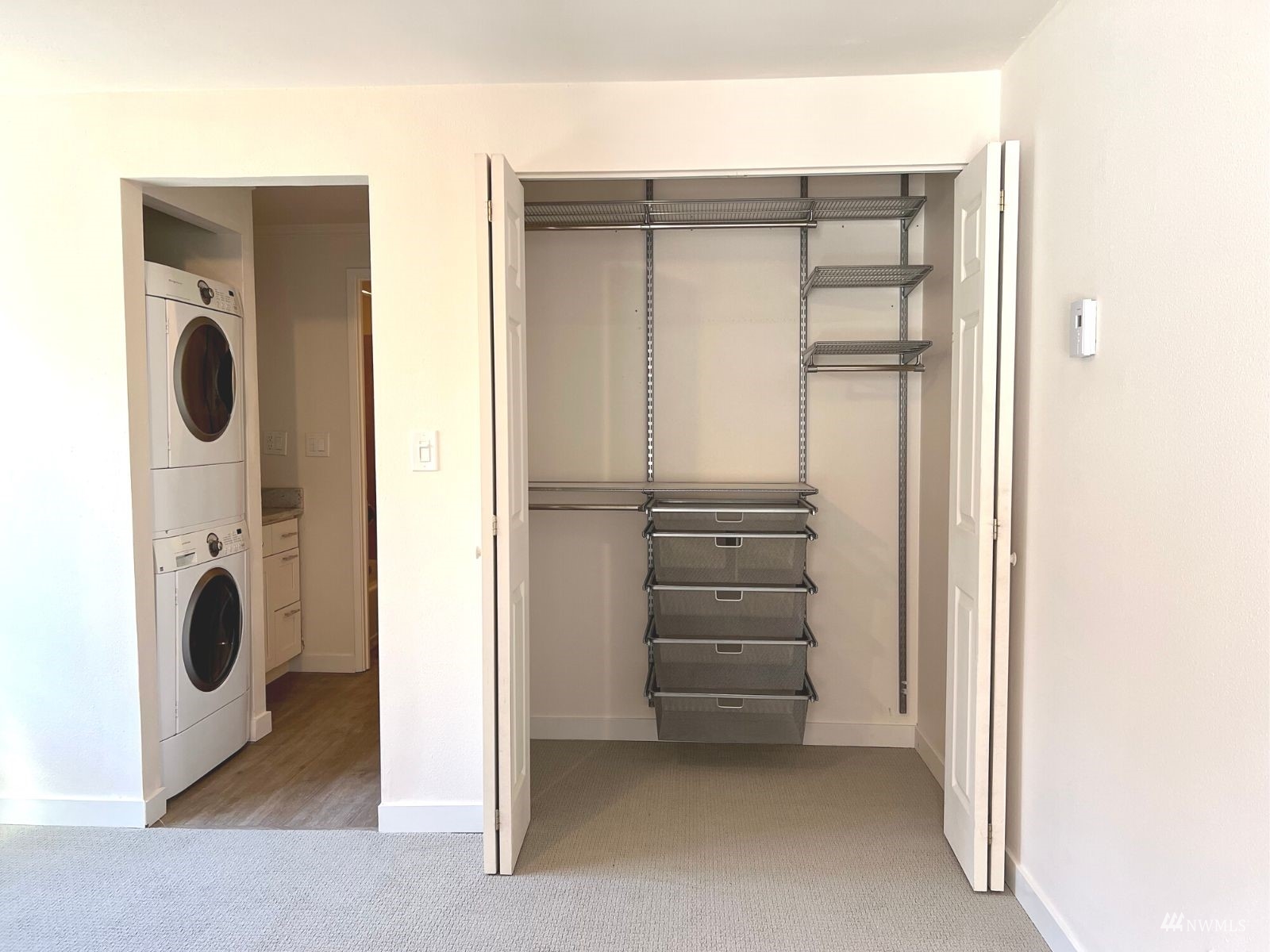1300 University Street, Unit 2C Seattle, WA 98101 - Photo 13 of 20 a view of a storage & utility room with washer and dryer