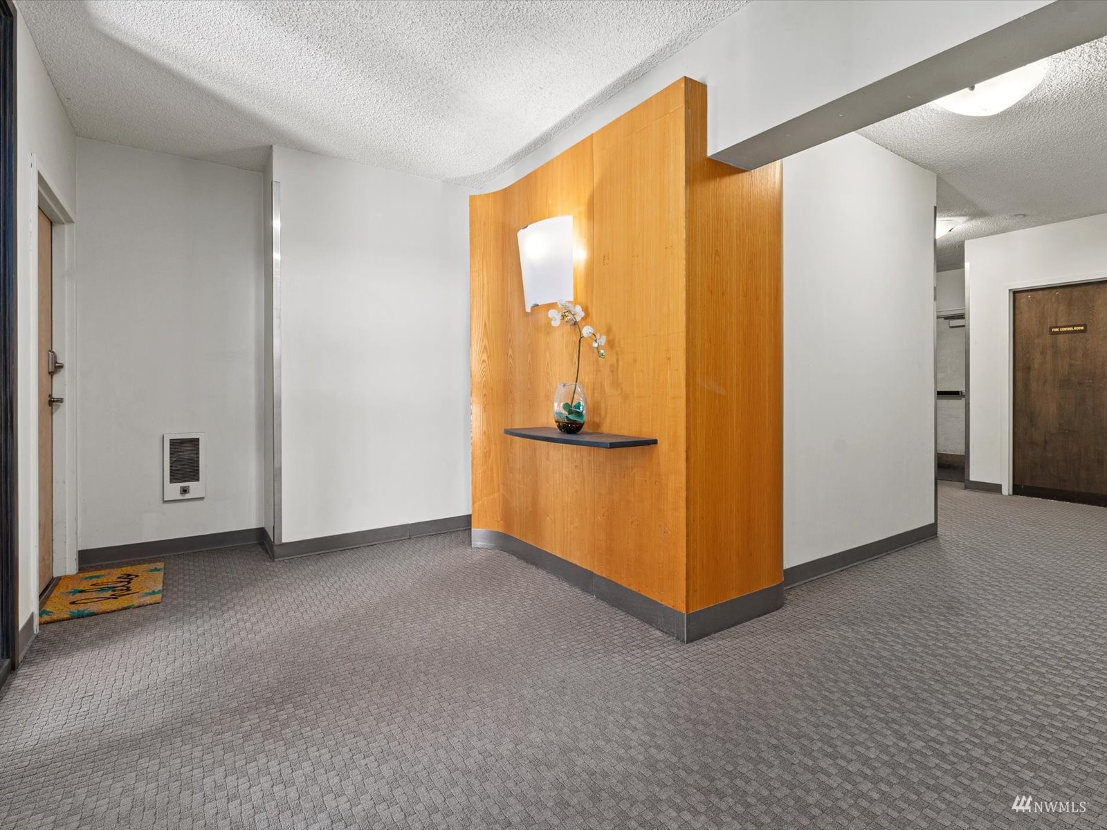 1300 University Street, Unit 2C Seattle, WA 98101 - Photo 17 of 20 a view of an empty room with closet and a window